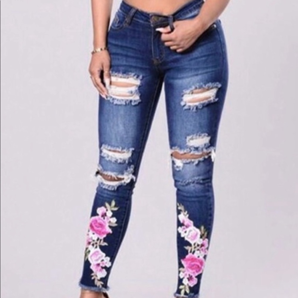 SOLD Jeans with red floral design. Size Small Long